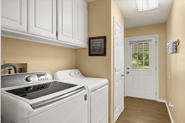 251 Dunn Dr, Palo Pinto, TX 76484 - laundry room with cabinet space, independent washer and dryer, wood finished floors, and baseboards