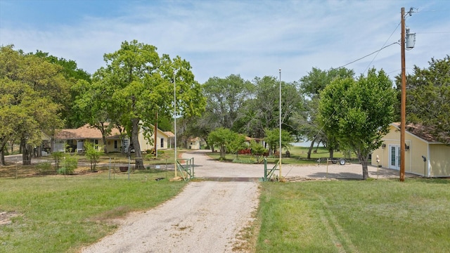 251 Dunn Dr, Palo Pinto, TX 76484 - view of dirt / gravel driveway with a gated entry