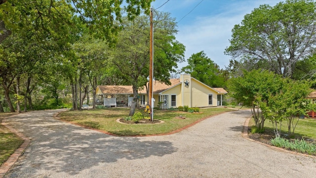 251 Dunn Dr, Palo Pinto, TX 76484 - ranch-style home featuring driveway and a chimney