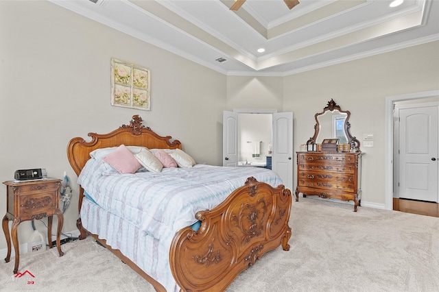 3032 Sagefield Ln, Haughton, LA 71037 - bedroom with light carpet, ornamental molding, a tray ceiling, ensuite bathroom, and a ceiling fan