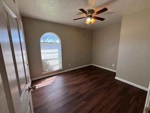 128 W Way Dr, Allen, TX 75002 - spare room featuring dark wood finished floors, a ceiling fan, baseboards, and a textured ceiling