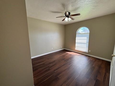 128 W Way Dr, Allen, TX 75002 - unfurnished room featuring a textured ceiling, baseboards, ceiling fan, and wood finished floors