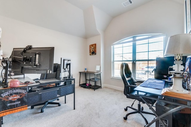 carpeted office with baseboards, visible vents, and lofted ceiling