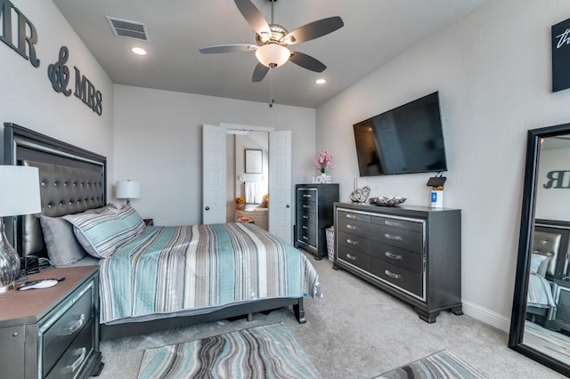 bedroom with visible vents, recessed lighting, ceiling fan, and light colored carpet