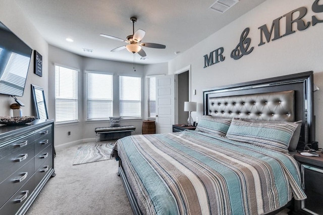 bedroom with carpet floors, baseboards, ceiling fan, and visible vents