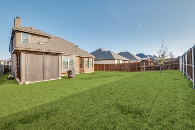 view of yard featuring a fenced backyard