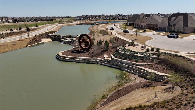 aerial view with a water view and a residential view