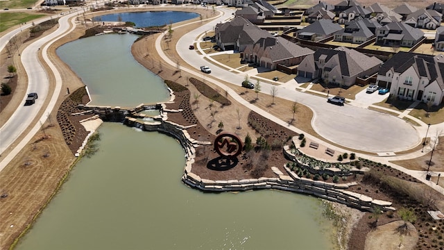 aerial view featuring a residential view and a water view