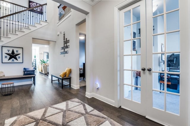 entryway featuring stairway, baseboards, french doors, and dark wood-style floors
