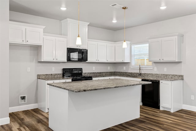 kitchen featuring dark wood-type flooring, a sink, visible vents, white cabinets, and black appliances