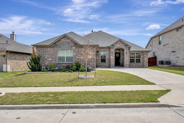 304 Welch Folly Ln, Aledo, TX 76008 - french country home featuring brick siding, a front lawn, and a shingled roof