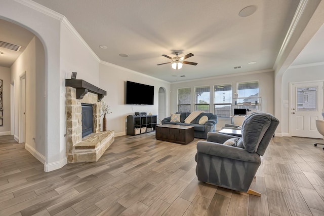 304 Welch Folly Ln, Aledo, TX 76008 - living area with arched walkways, light wood finished floors, baseboards, and crown molding