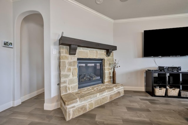 304 Welch Folly Ln, Aledo, TX 76008 - living area featuring crown molding, baseboards, arched walkways, and a stone fireplace