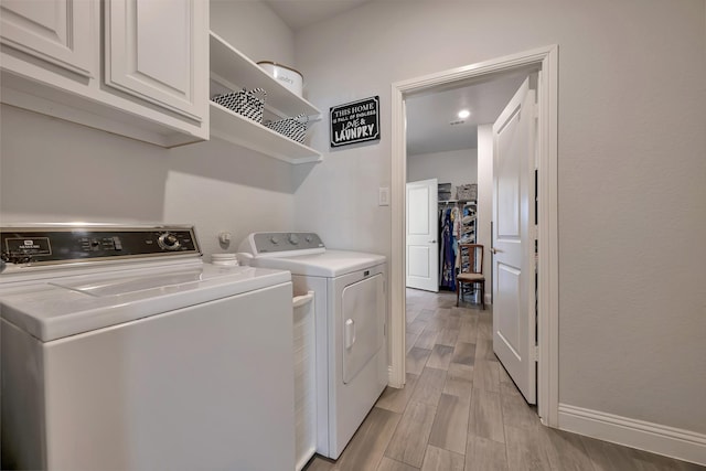 304 Welch Folly Ln, Aledo, TX 76008 - laundry area with independent washer and dryer, cabinet space, light wood finished floors, and baseboards