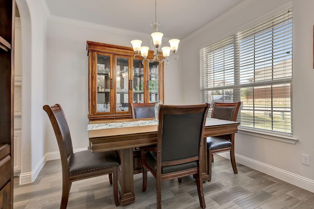 304 Welch Folly Ln, Aledo, TX 76008 - dining space with a chandelier, crown molding, baseboards, and light wood-style floors