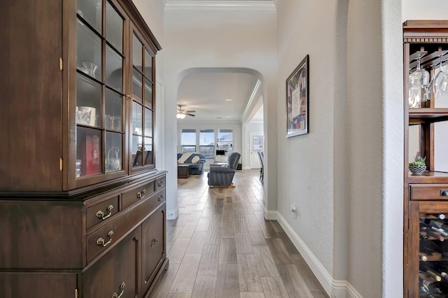 304 Welch Folly Ln, Aledo, TX 76008 - corridor featuring arched walkways, crown molding, baseboards, and wood finished floors