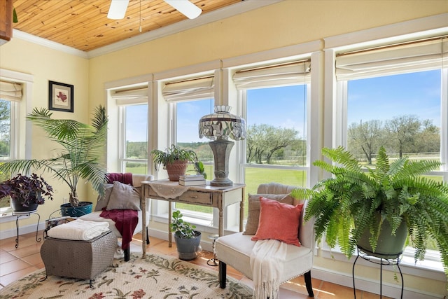 sunroom featuring crown molding and tile patterned floors