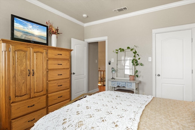 bedroom with crown molding and visible vents