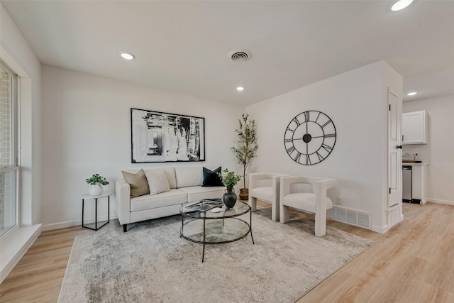 2809 Maple Dr, Garland, TX 75042 - living room with light wood finished floors, baseboards, and recessed lighting