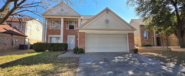 view of front of home featuring a garage, brick siding, central AC, and driveway