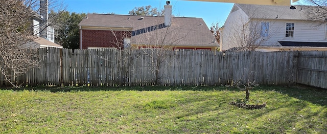 view of yard with a fenced backyard