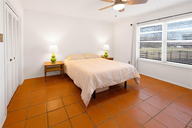 4379 Capra Way, Benbrook, TX 76126 - tiled bedroom with baseboards, a closet, ceiling fan, ornamental molding, and a textured ceiling
