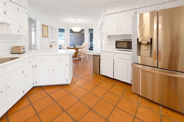 4379 Capra Way, Benbrook, TX 76126 - kitchen featuring stainless steel fridge, crown molding, a peninsula, white cabinetry, and light countertops