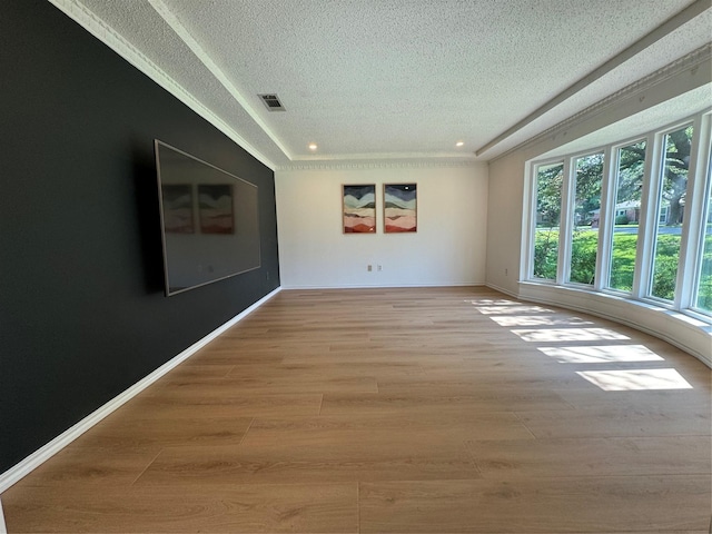 4379 Capra Way, Benbrook, TX 76126 - empty room with a textured ceiling, plenty of natural light, light wood-style flooring, recessed lighting, and baseboards