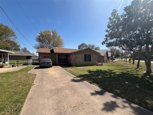 167 Seaside, Gun Barrel City, TX 75156 - ranch-style house with a front lawn, driveway, fence, brick siding, and a garage