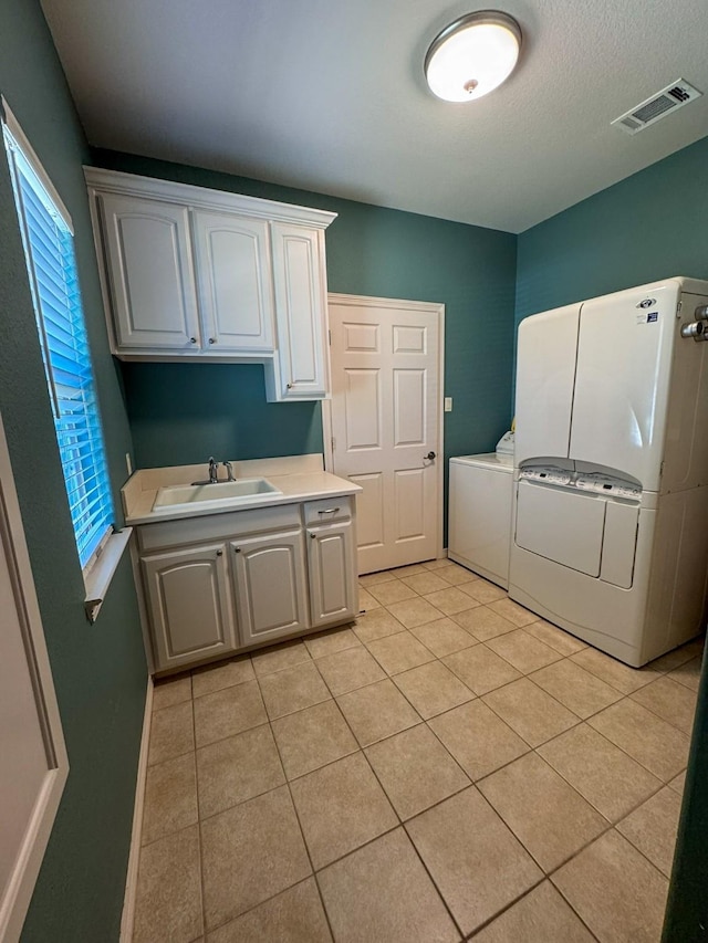 507 W 2nd St, Maypearl, TX 76064 - laundry room featuring cabinet space and light tile patterned floors