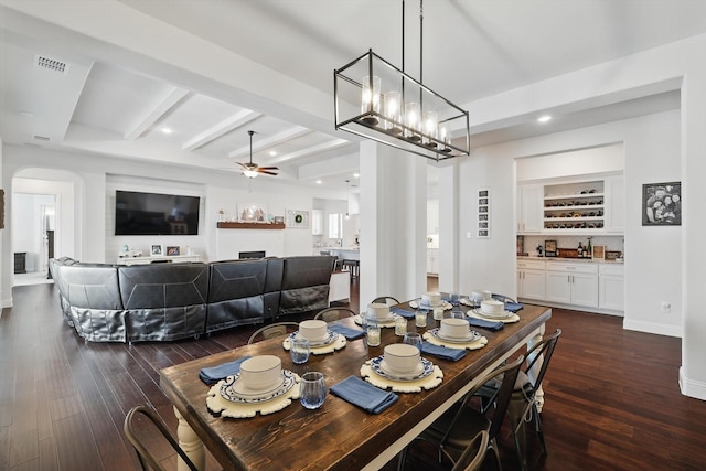 1208 S Pecan Pkwy, Northlake, TX 76247 - dining room featuring a ceiling fan, visible vents, dark wood-type flooring, arched walkways, and beamed ceiling