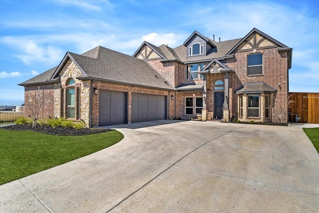 1261 Duke Dr, Prosper, TX 75078 - view of front of house featuring a garage, a front yard, fence, brick siding, and driveway