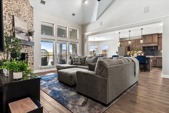 1261 Duke Dr, Prosper, TX 75078 - living area with wood finished floors and high vaulted ceiling