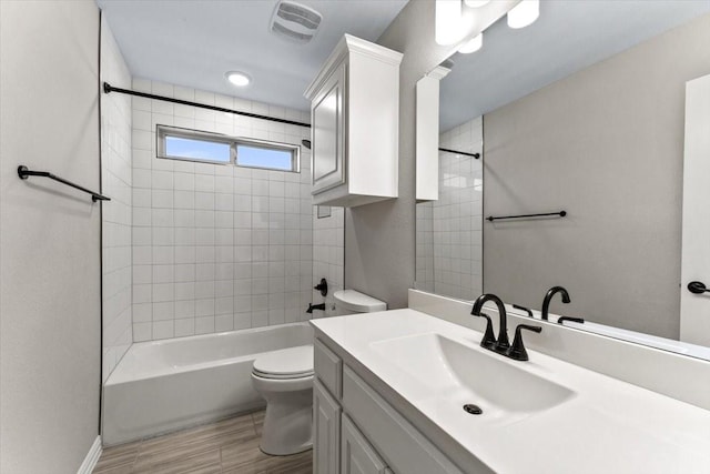 1261 Duke Dr, Prosper, TX 75078 - full bath featuring visible vents, toilet, shower / bath combination, wood finished floors, and vanity