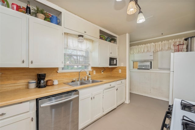 kitchen featuring light countertops, a sink, white appliances, tasteful backsplash, and white cabinetry