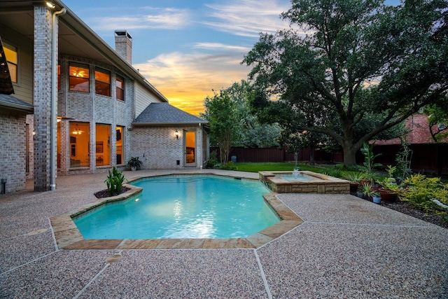 6004 Blossom Ct, Mckinney, TX 75072 - pool at dusk with a patio area, a fenced backyard, and a pool with connected hot tub