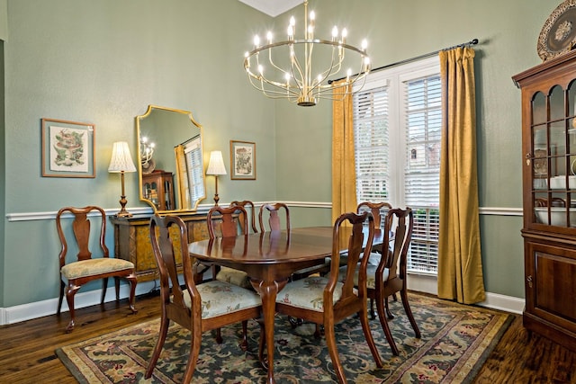 6004 Blossom Ct, Mckinney, TX 75072 - dining space featuring a chandelier, wood finished floors, and baseboards