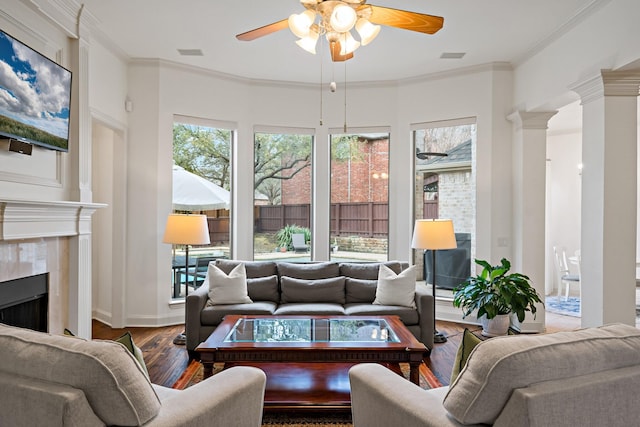 6004 Blossom Ct, Mckinney, TX 75072 - living room featuring a ceiling fan, wood finished floors, plenty of natural light, a fireplace, and ornamental molding