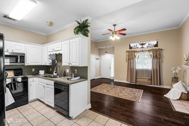 kitchen featuring white cabinetry, ornamental molding, a sink, ceiling fan, and black appliances