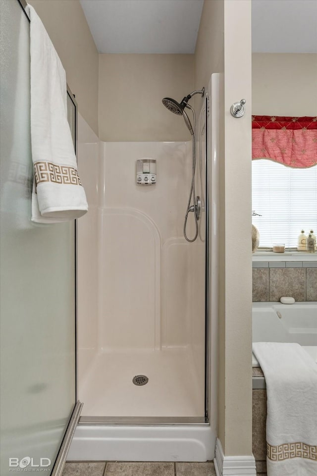 bathroom with a shower stall