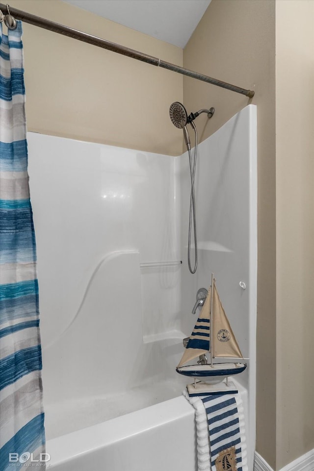 bathroom with shower / bath combo