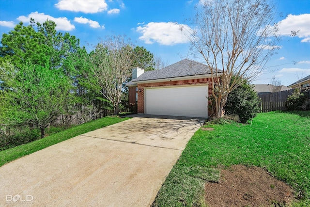 exterior space featuring concrete driveway, fence, an attached garage, brick siding, and a lawn