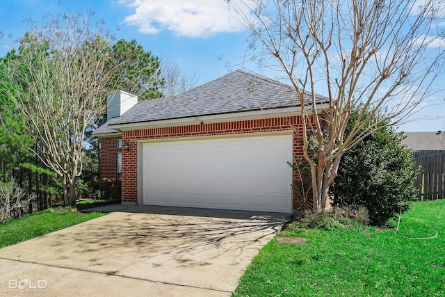 garage featuring driveway and fence