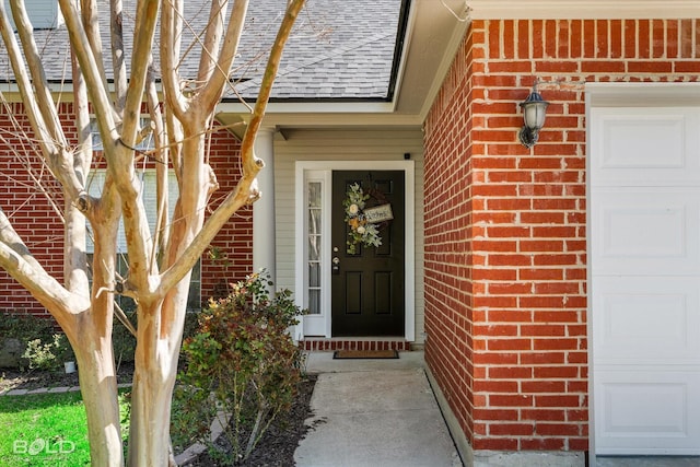 entrance to property with brick siding and roof with shingles