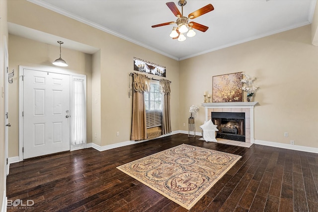 entrance foyer with wood-type flooring, baseboards, a fireplace, and ceiling fan