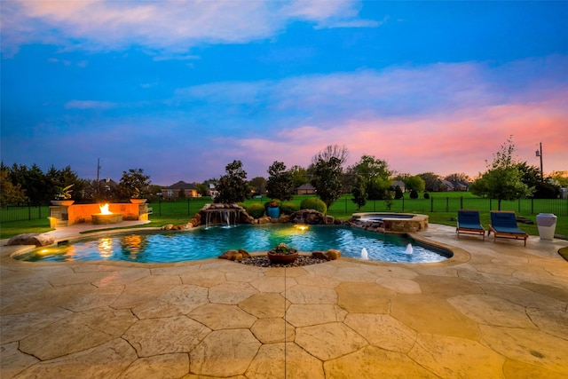 15961 Custer Trl, Frisco, TX 75035 - pool at dusk featuring a patio and a pool with connected hot tub