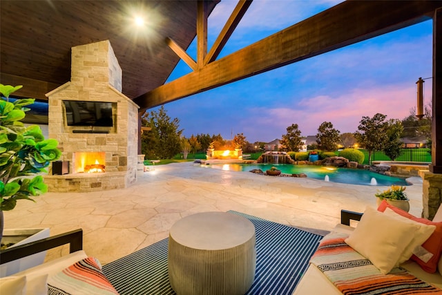 15961 Custer Trl, Frisco, TX 75035 - view of patio with an outdoor stone fireplace and a pool with connected hot tub
