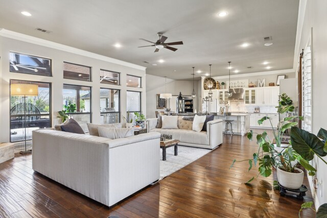 15961 Custer Trl, Frisco, TX 75035 - living area featuring ornamental molding, a ceiling fan, recessed lighting, and dark wood-style floors
