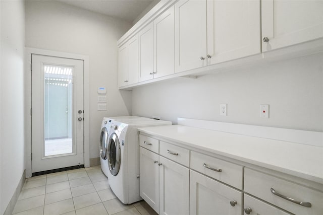 613 E Wall St, Grapevine, TX 76051 - washroom with cabinet space, separate washer and dryer, light tile patterned flooring, and baseboards