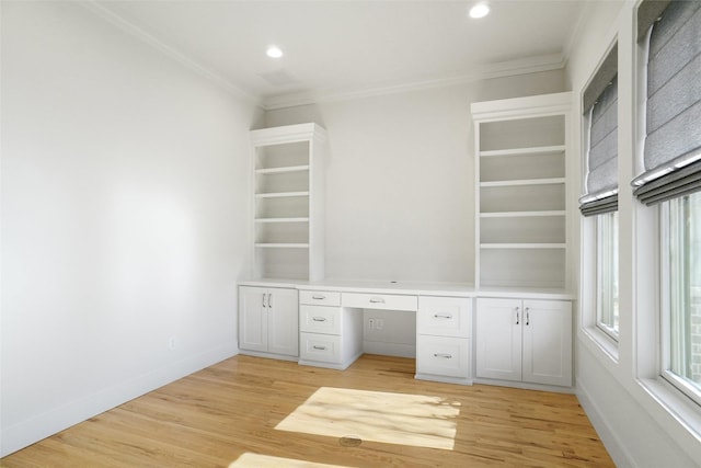 613 E Wall St, Grapevine, TX 76051 - unfurnished office featuring built in desk, ornamental molding, baseboards, and light wood finished floors